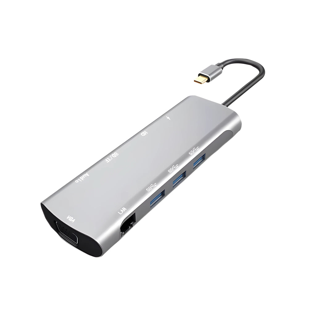 Grey aluminium USB-C docking station showing HDMI, VGA, USB 3.0, and USB-C PD ports with a short attached cable.
