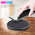 Black circular Qi wireless charging pad for iPhone 11 with LED indicator