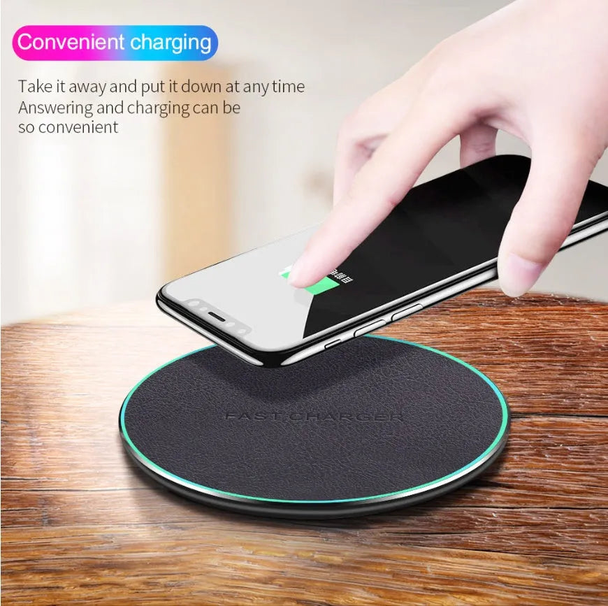 Black circular Qi wireless charging pad for iPhone 11 with LED indicator