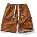 Men's loose-fit bamboo fibre shorts in coffee colour, showing straight-leg cropped design on a hanger.