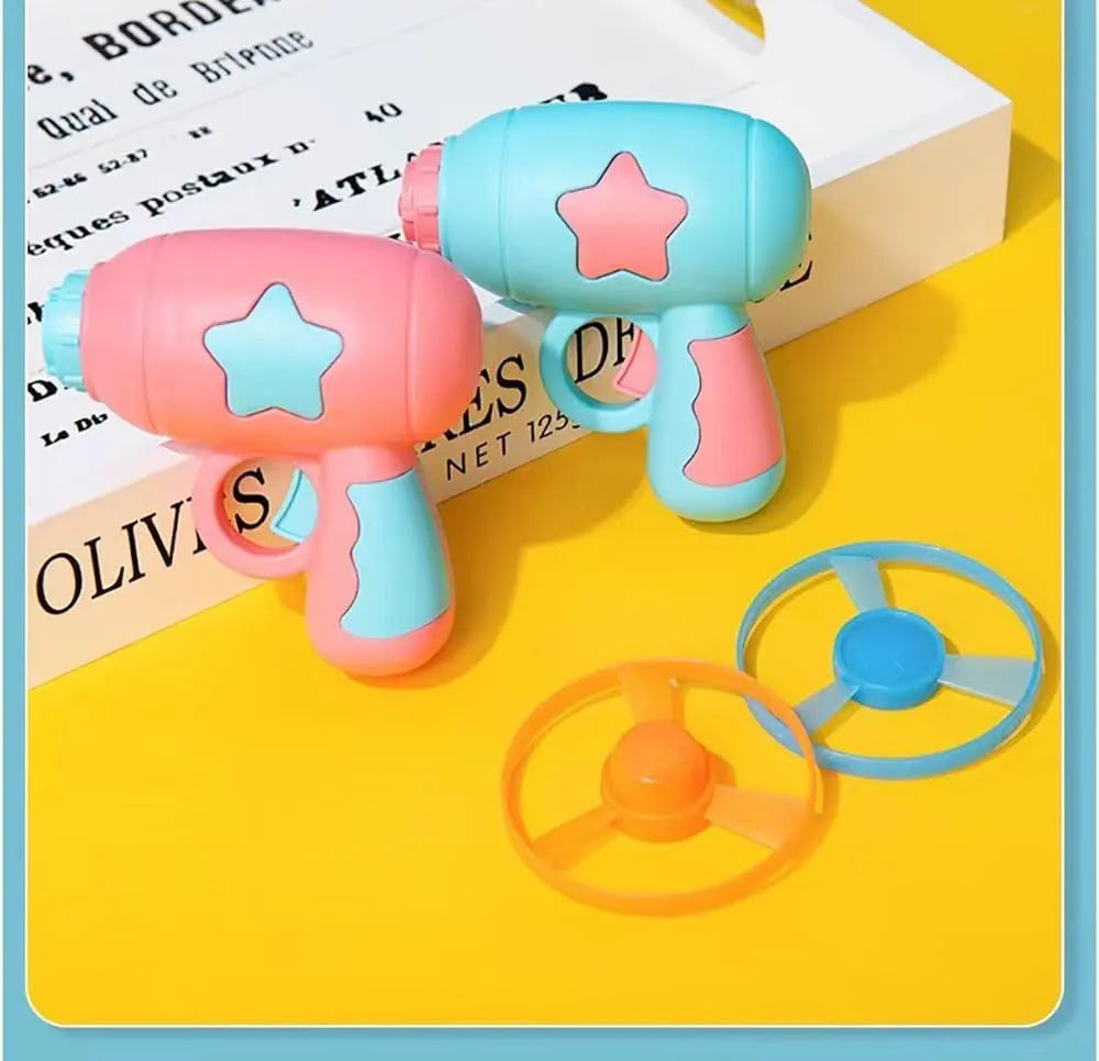 Blue interactive cat toy gun with plastic frisbee on launch mechanism for indoor feline play