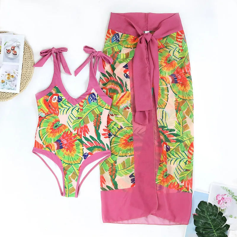 Retro floral print one-piece swimsuit with V-neck, covered belly design and thin skirt in pink colour