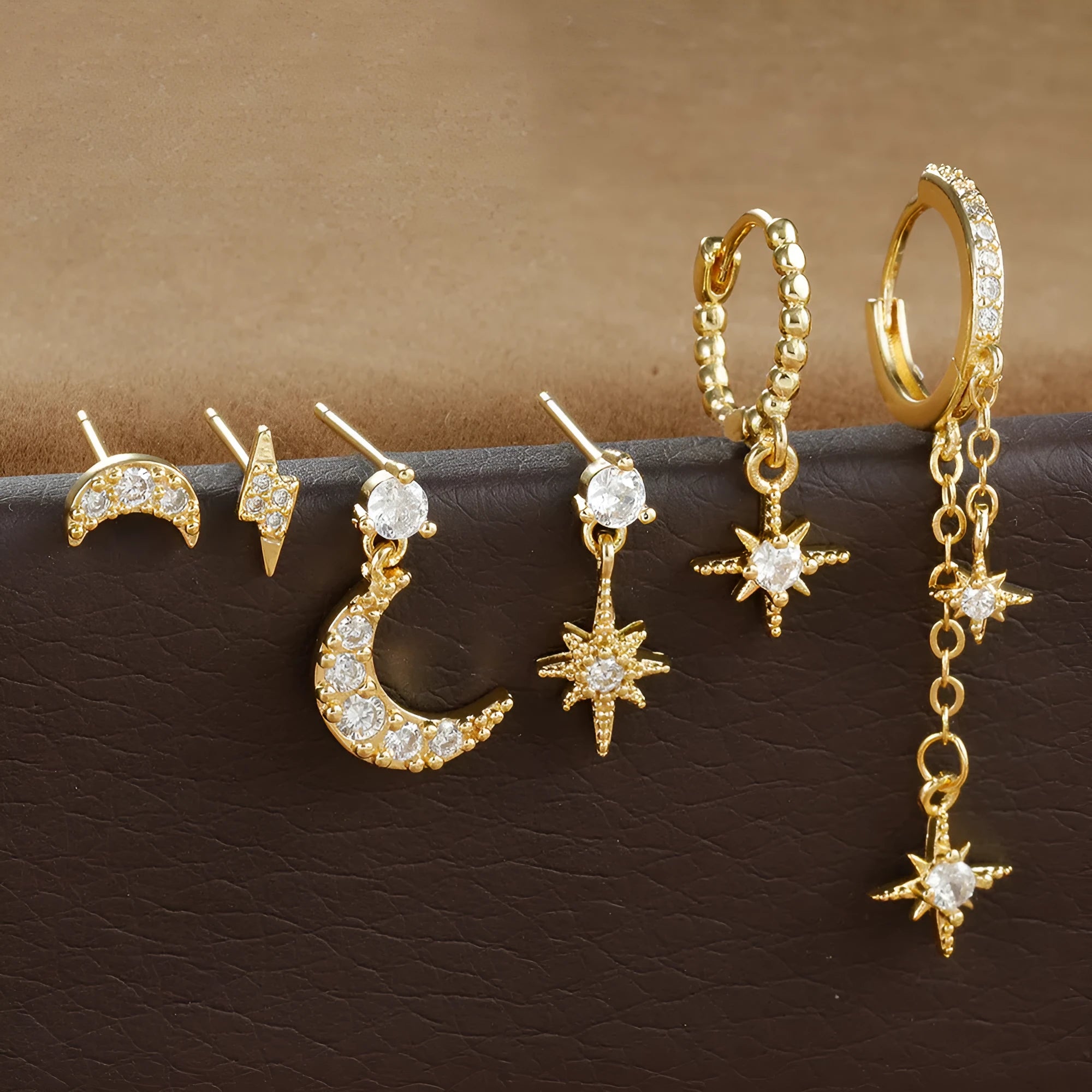 XINGX gold electroplated chain tassel earrings set with six pieces showing zircon stud details on copper earrings