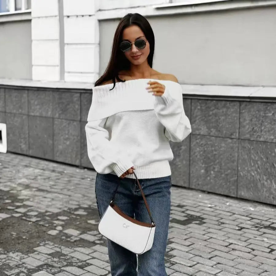 Grey off-the-shoulder strapless pullover sweater with a 3D pattern on a model.