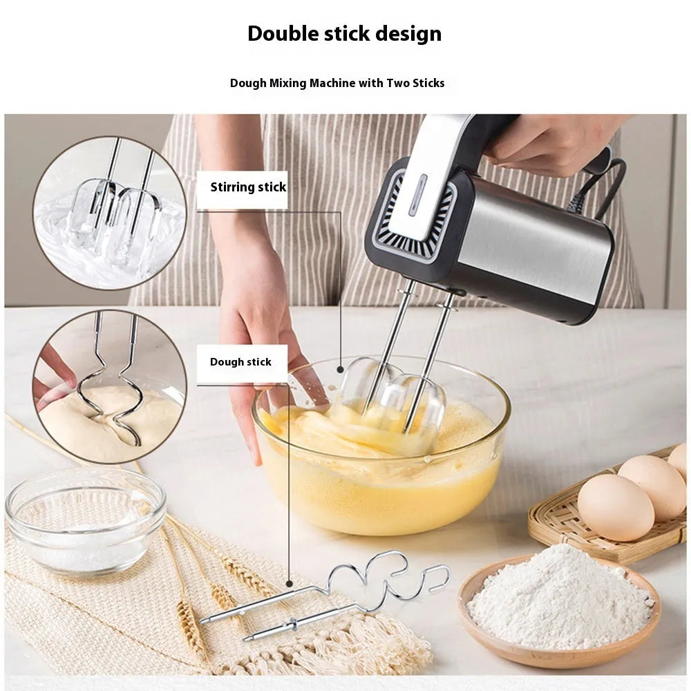 Silver mini electric hand mixer with stainless steel beaters on a 5-speed control dial.