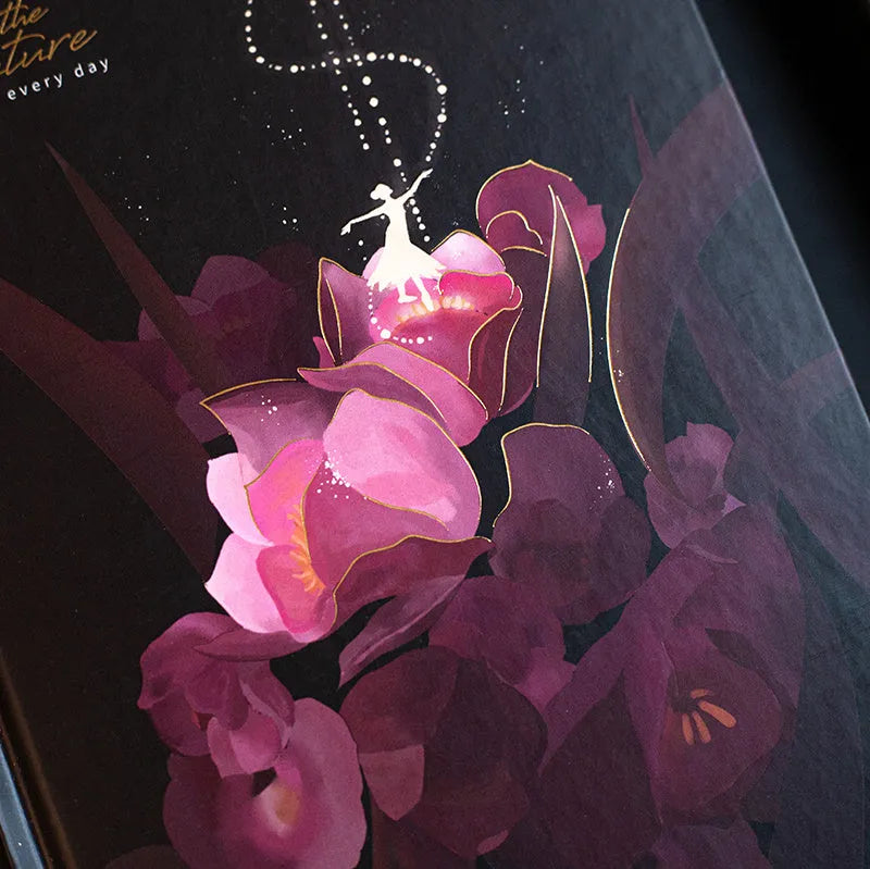 A5 notebook with luminous cover showing colour illustrations on open pages