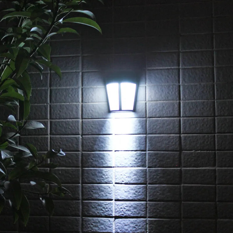 Solar-powered outdoor wall lamp with LED lights and sensor control for garden and courtyard illumination