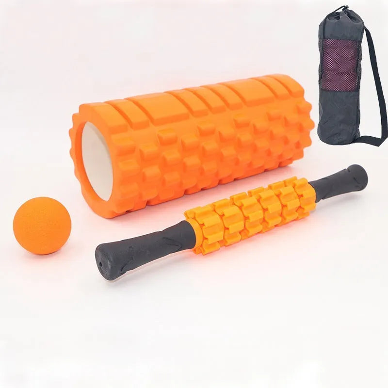 Black foam roller massage stick with gear design, 33cm long, on a plain background.