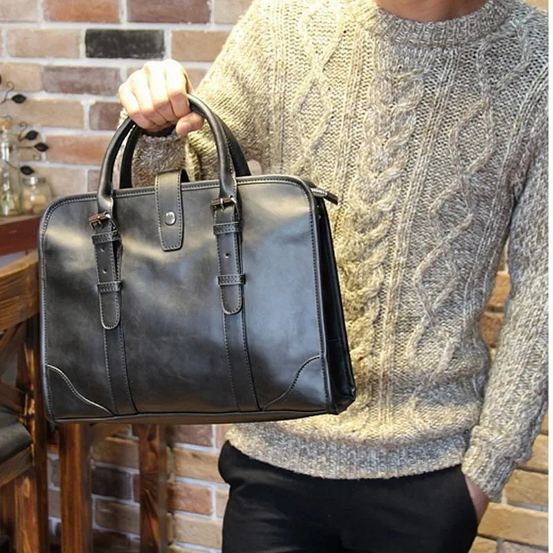 Men's cowhide leather handbag in black with zipper closure and hard handle