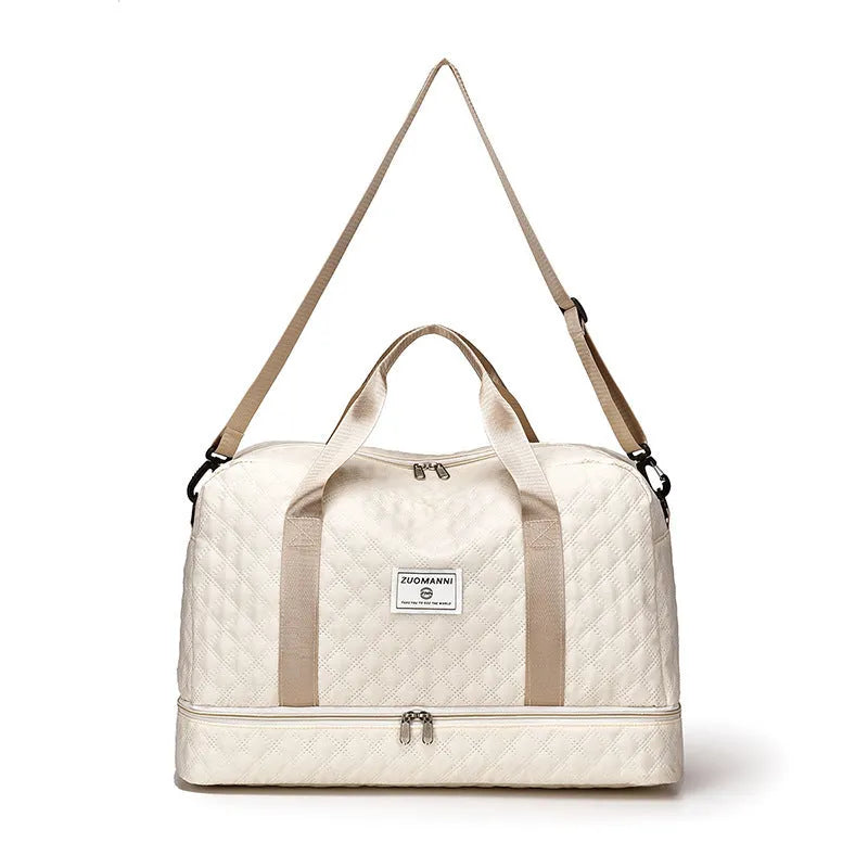 Large grey and pink Oxford cloth leisure travel bag with sewing thread detail on a white background.