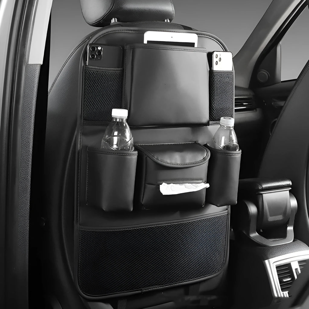 Black leather car seat back storage bag hanging on a vehicle seat.