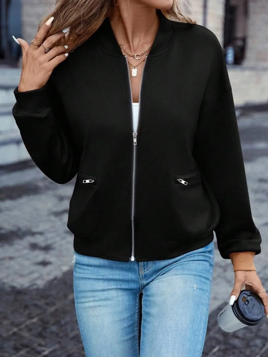 Black women's casual zip jacket with long sleeves and faux pockets on a model.