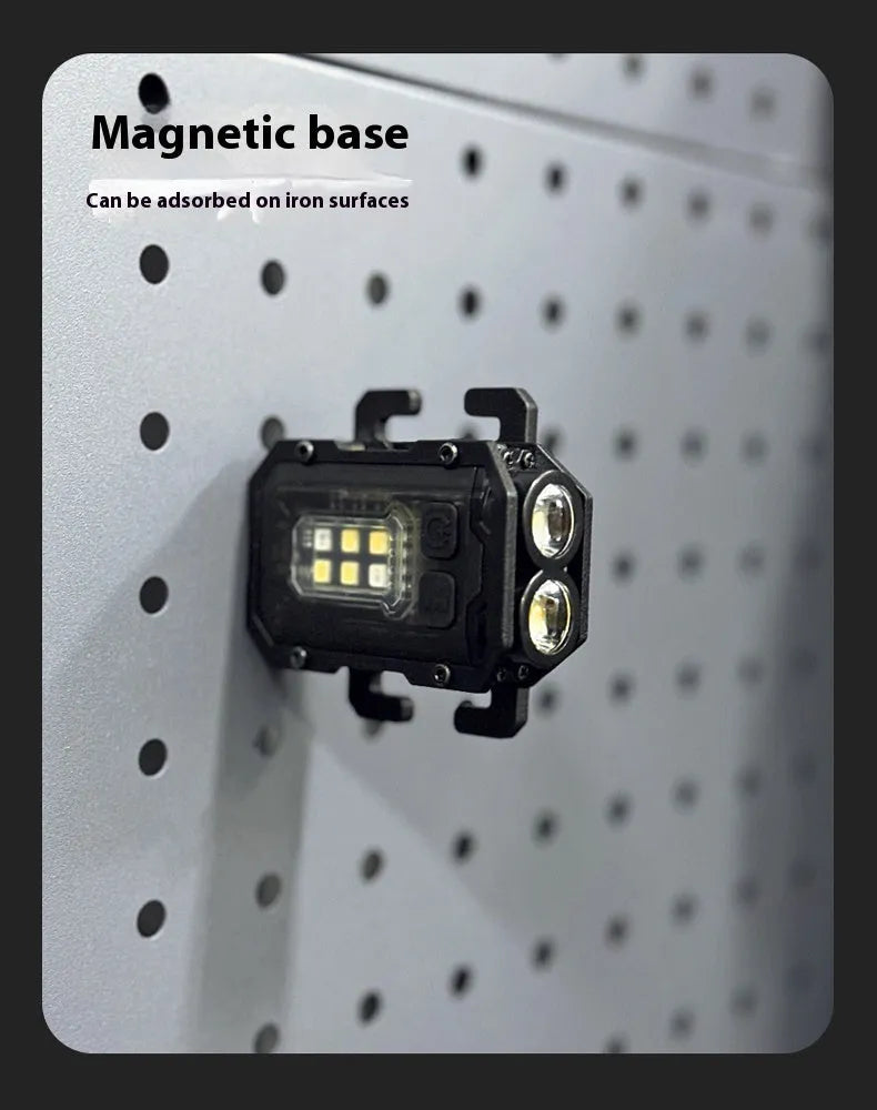 Compact black tactical warning flashlight with a USB charging cable and a clip for backpack mounting.