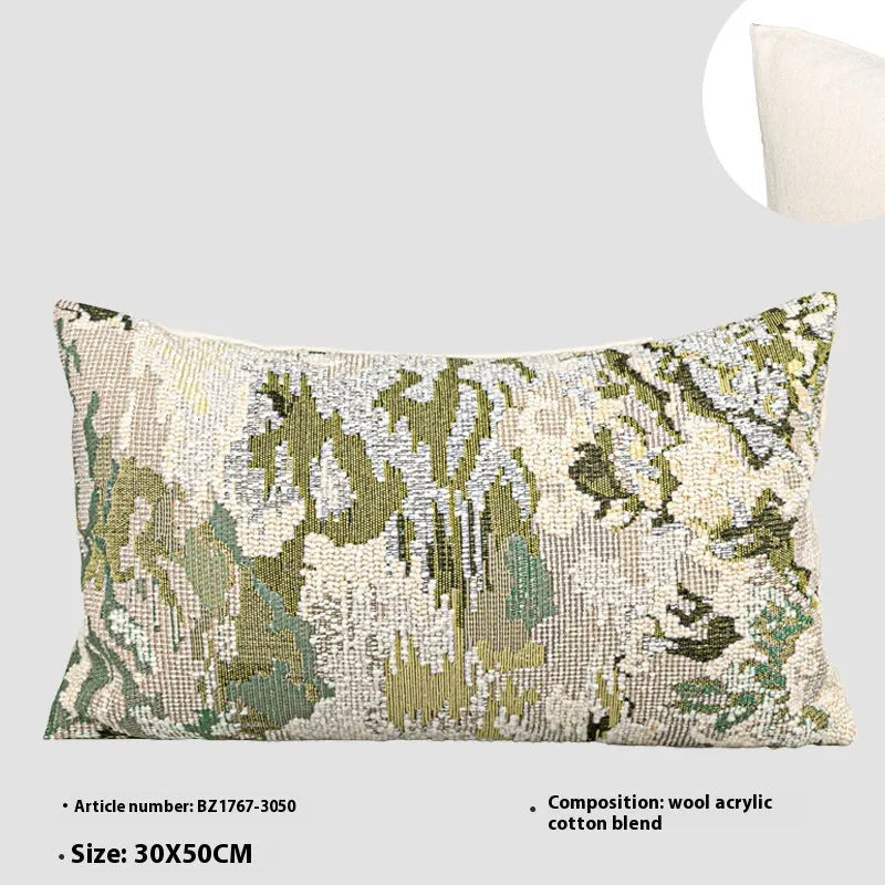 Green abstract plants and flowers pattern wool blend cushion cover on a sofa, showing square and waist pillow sizes.