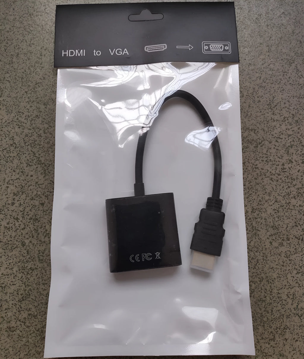 Black HDMI to VGA female adapter cable with a short 0.3 metre integrated HDMI cable.