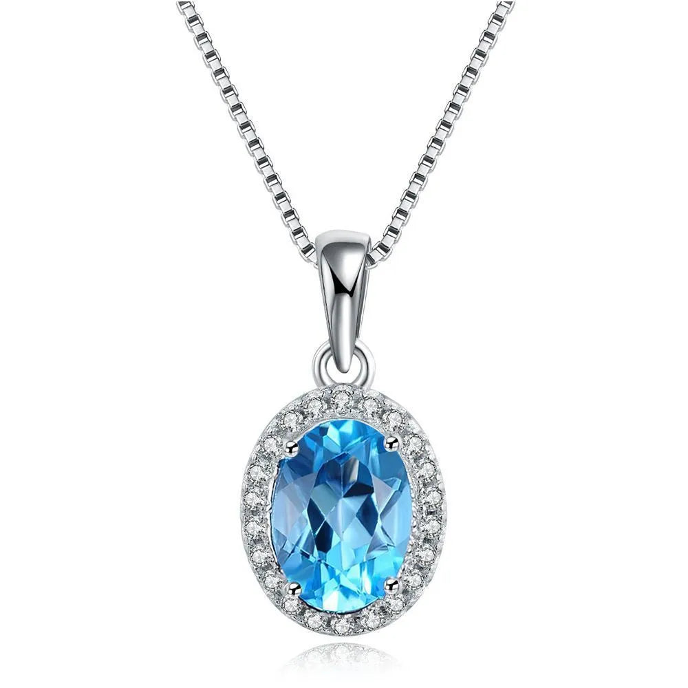 925 sterling silver blue topaz jewellery set with geometric design including earrings, ring, pendant and necklace