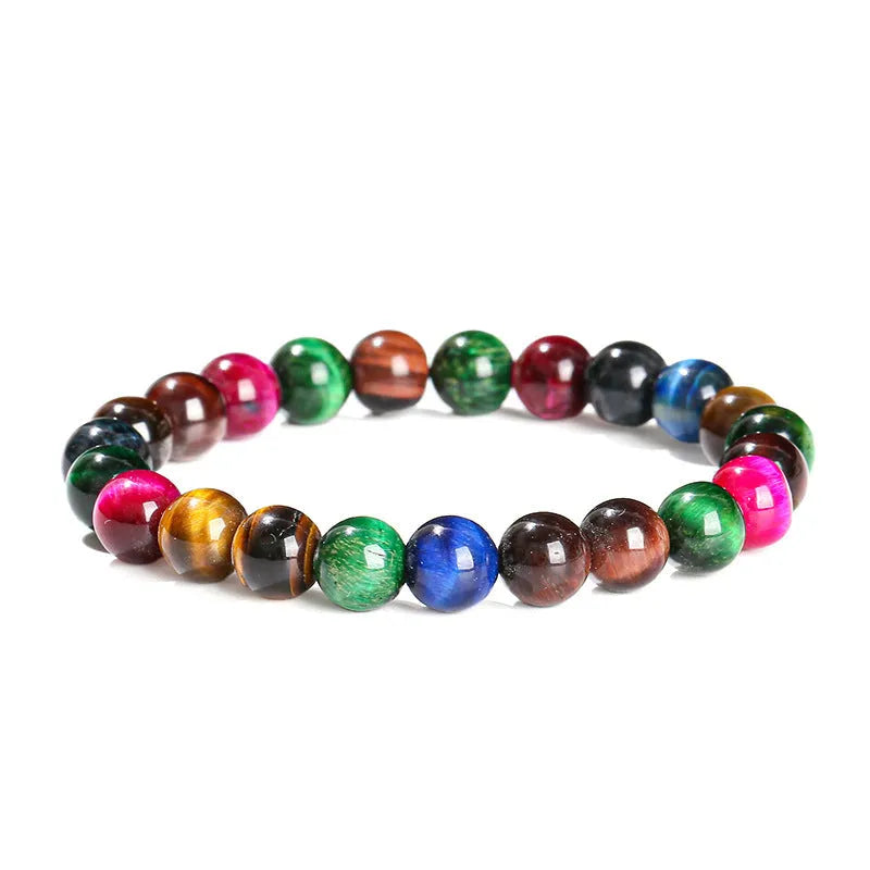 Colourful tiger eye bracelet with round beads in mixed sizes on a woman's wrist