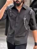 Men's black utility button-up shirt with regular fit styling on mannequin