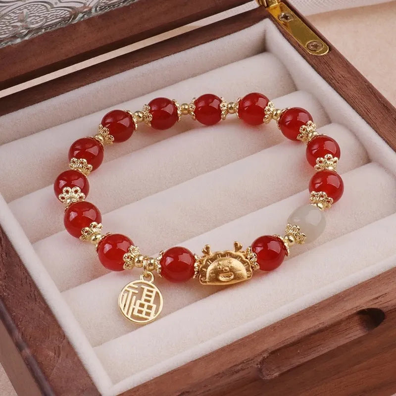 Women's glass bracelet with coloured glaze floral ice crack pattern featuring red, pink and white beads with zodiac elements