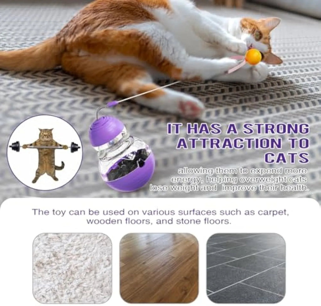 Purple electric interactive cat toy with a bouncing teaser wand and slow feeder dispenser on a rocking base.
