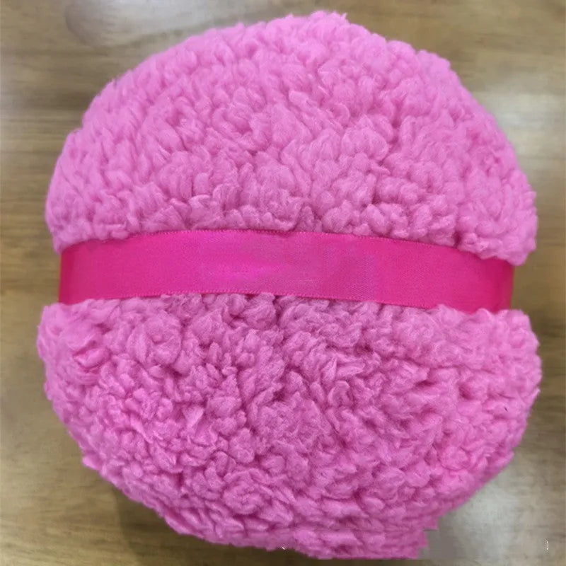Oversized plush powder puff for makeup application in white colour with 150x75mm dimensions