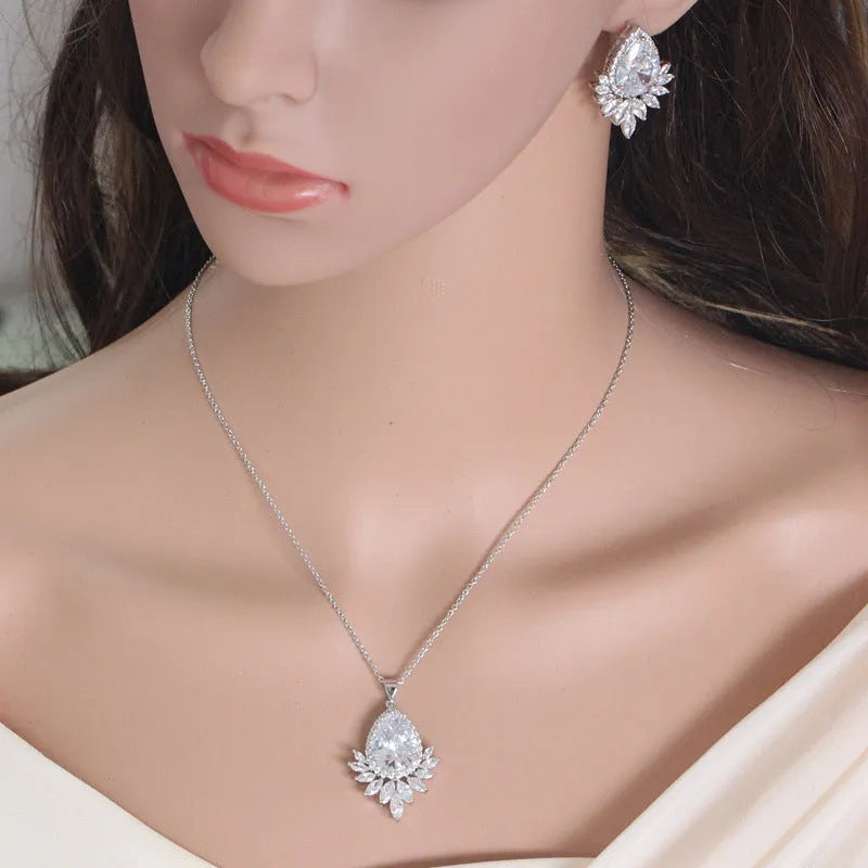 AAA formal jewellery set with necklace and earrings featuring cubic zirconia stones and crystal accents in blue, red, or white.