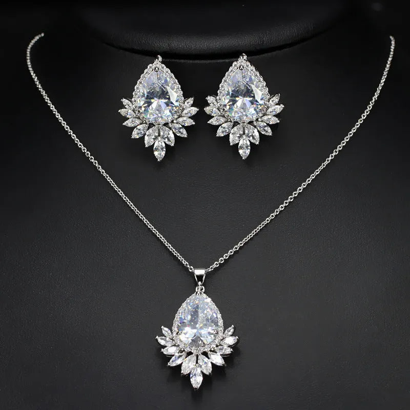 AAA formal jewellery set with necklace and earrings featuring cubic zirconia stones and crystal accents in blue, red, or white.
