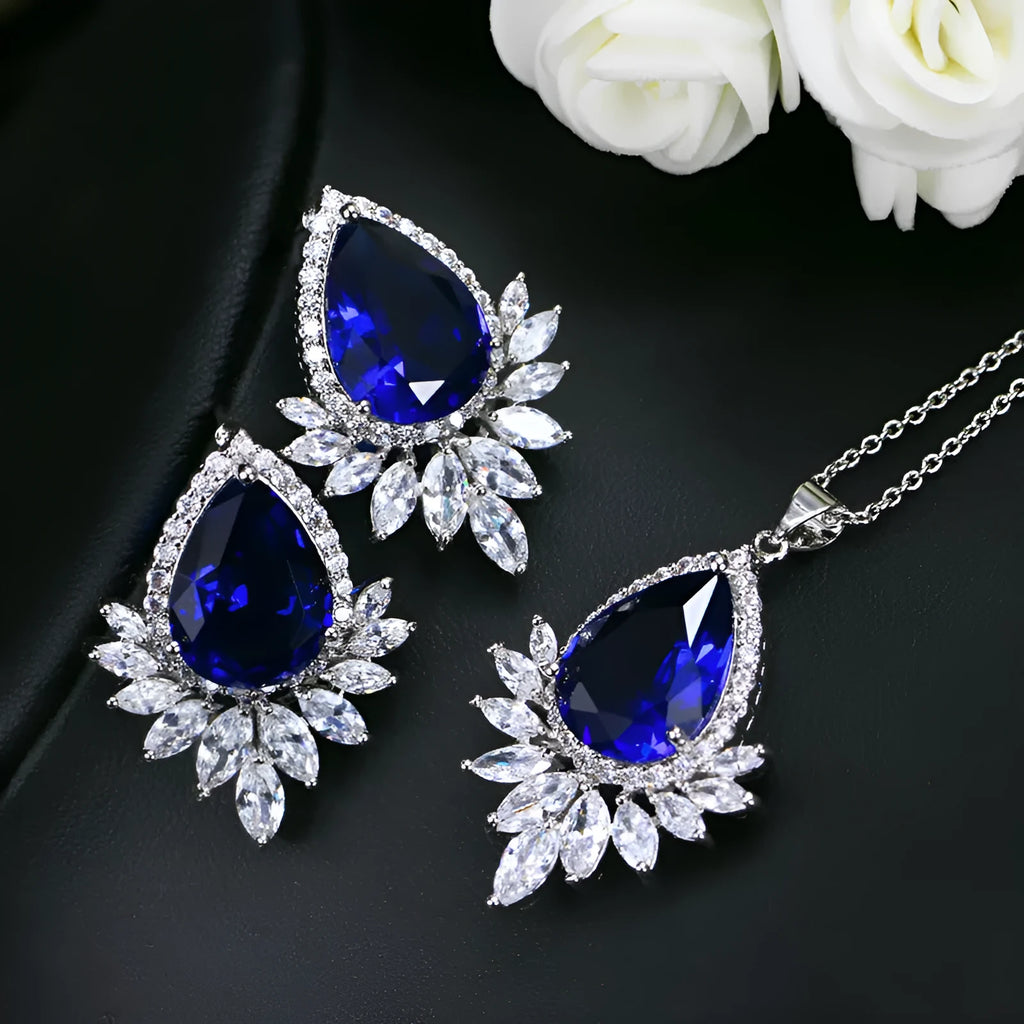 AAA formal jewellery set with necklace and earrings featuring cubic zirconia stones and crystal accents in blue, red, or white.