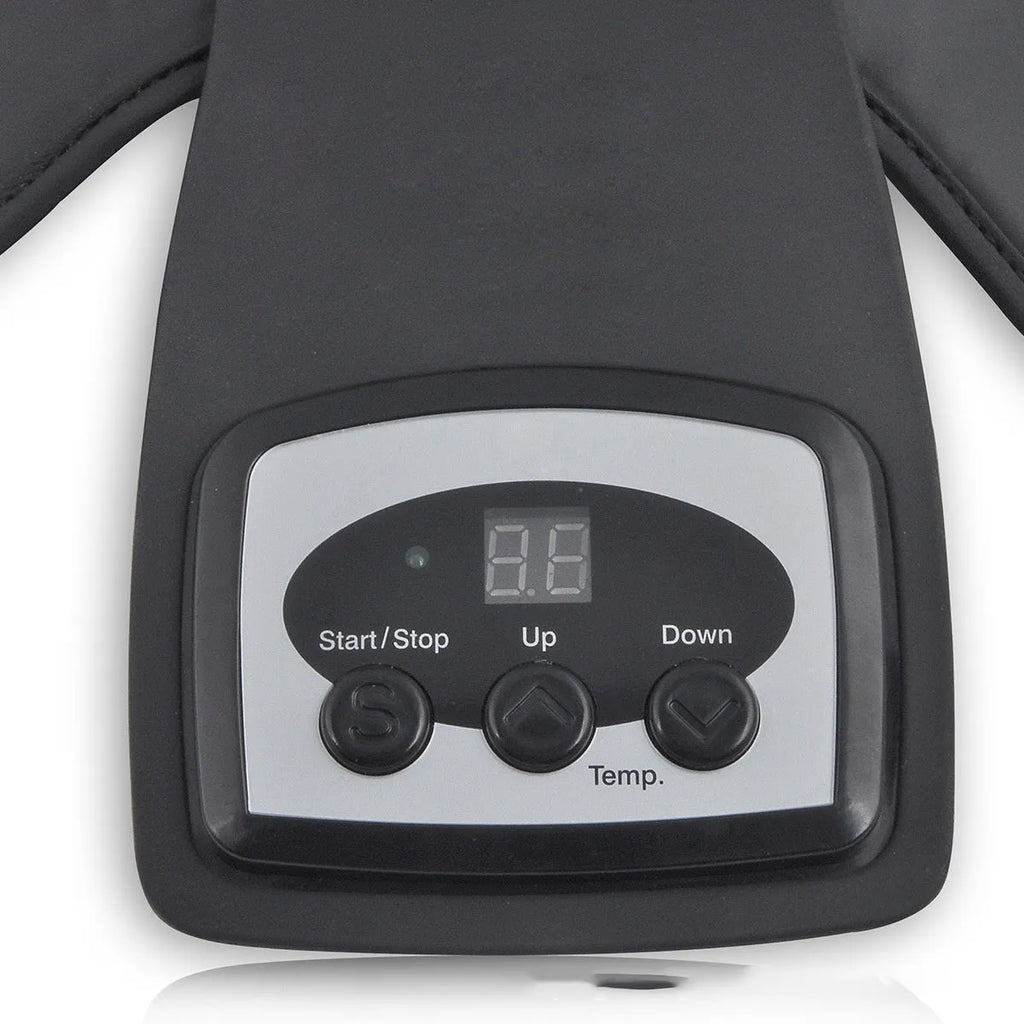 Infrared heat therapy knee and shoulder massager with pads and power adapter on a table.