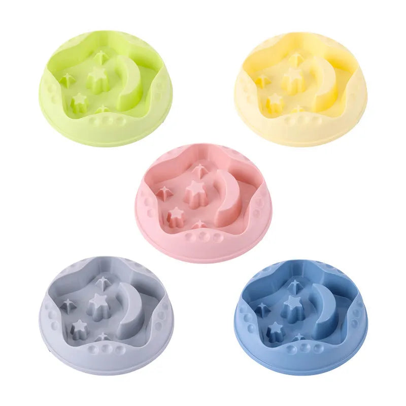 Large blue dog bowl with raised moon and star shapes inside as a slow feeder