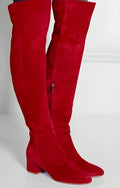 Grey women's suede over the knee flat boots with a chunky rubber sole and pointed toe.