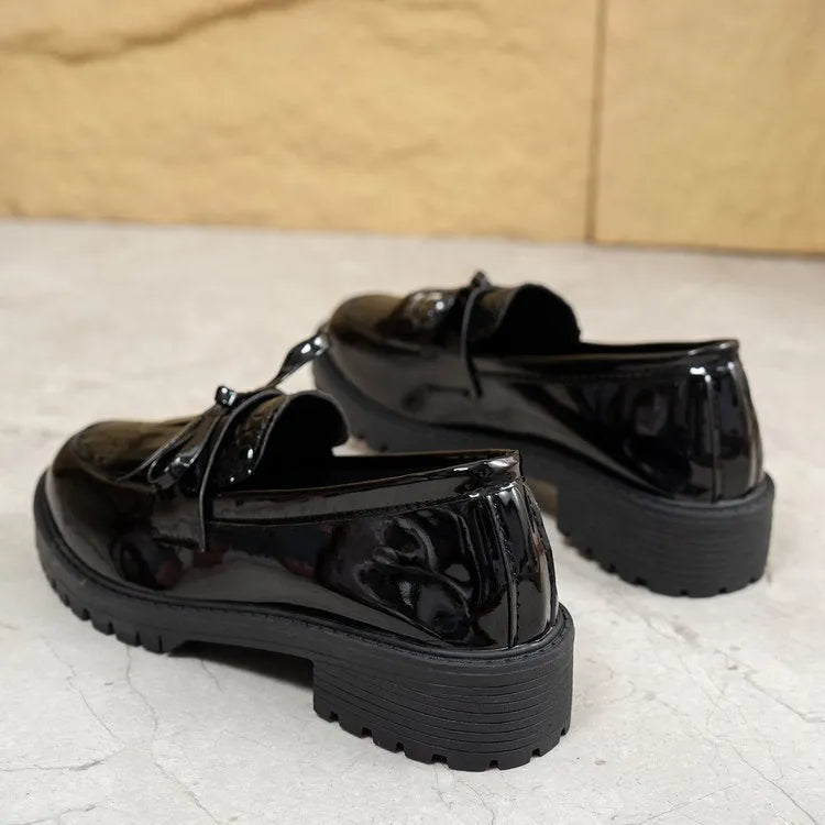 Women's brown loafers with bow detail and flat sole on artificial PU upper