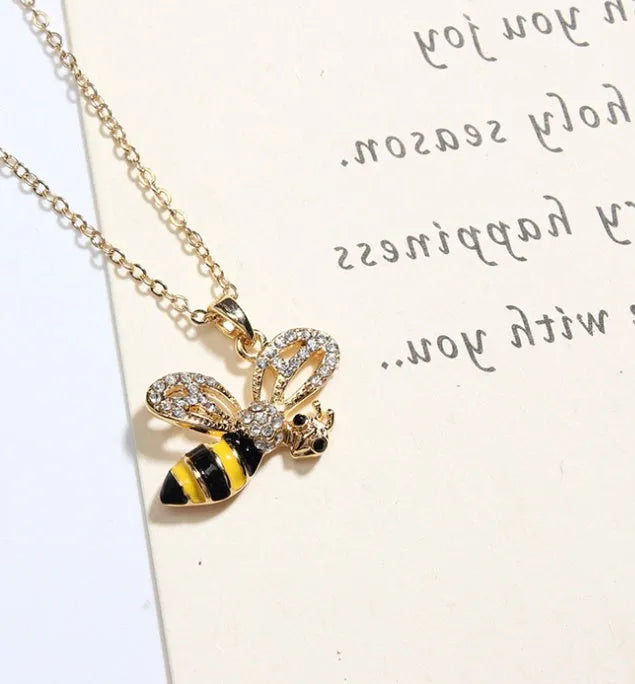 Cartoon bee drop pendant necklace on alloy cross chain for women, available in coffee, yellow, red colours