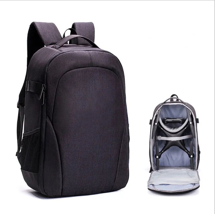 Black Oxford cloth drone backpack open to show internal camera, computer, and organiser pockets.