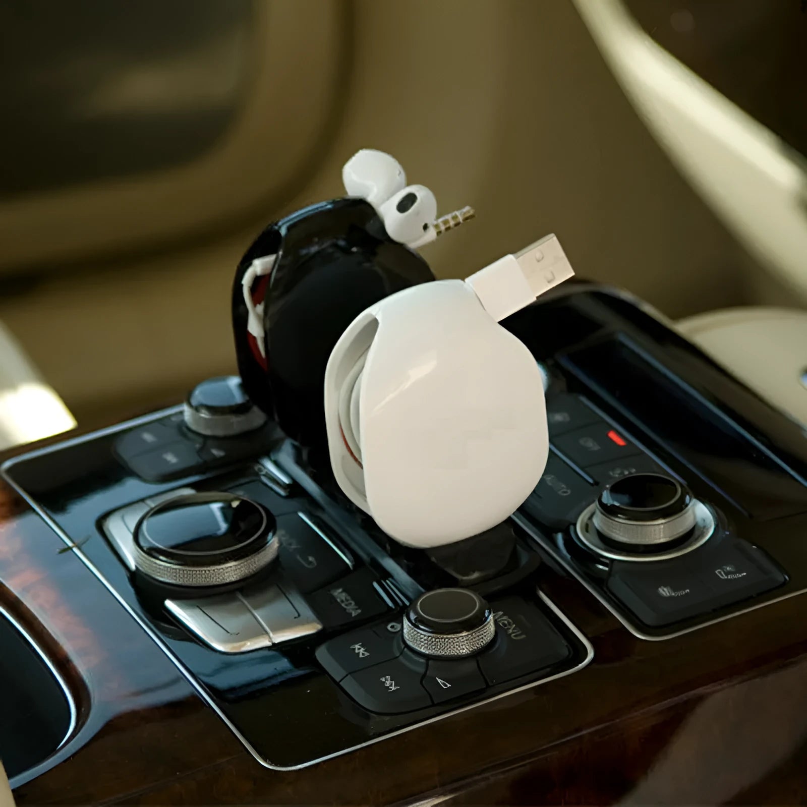 Automatic earphone cable winder retractor in a compact plastic case.