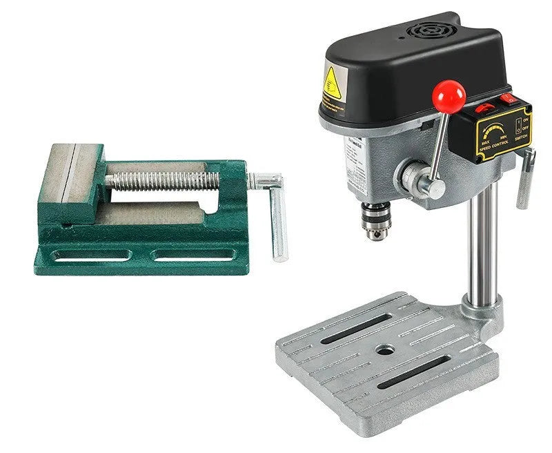 Mini bench drill and milling machine with heavy-duty cross bench pliers on workshop bench