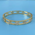 Gold and silver hollow women's bracelets with four-leaf clover charms and zircon stones.