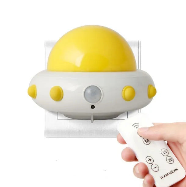 Remote control UFO-shaped bedside night light in blue, pink, or white with LED lighting