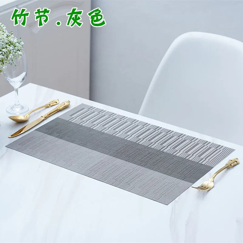 PVC non-slip place mat in gradient bamboo colour on a kitchen countertop.