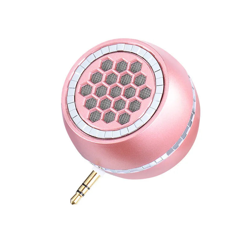 Universal external amplifier speaker in black, local gold, and rose gold finishes, showing wired input and USB power port.