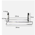 Silver stainless steel paper towel rack mounted on a kitchen cabinet door.