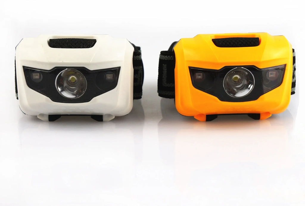 Cat Eye 2 generation head torch in black, showing white and red LEDs on an adjustable head strap.