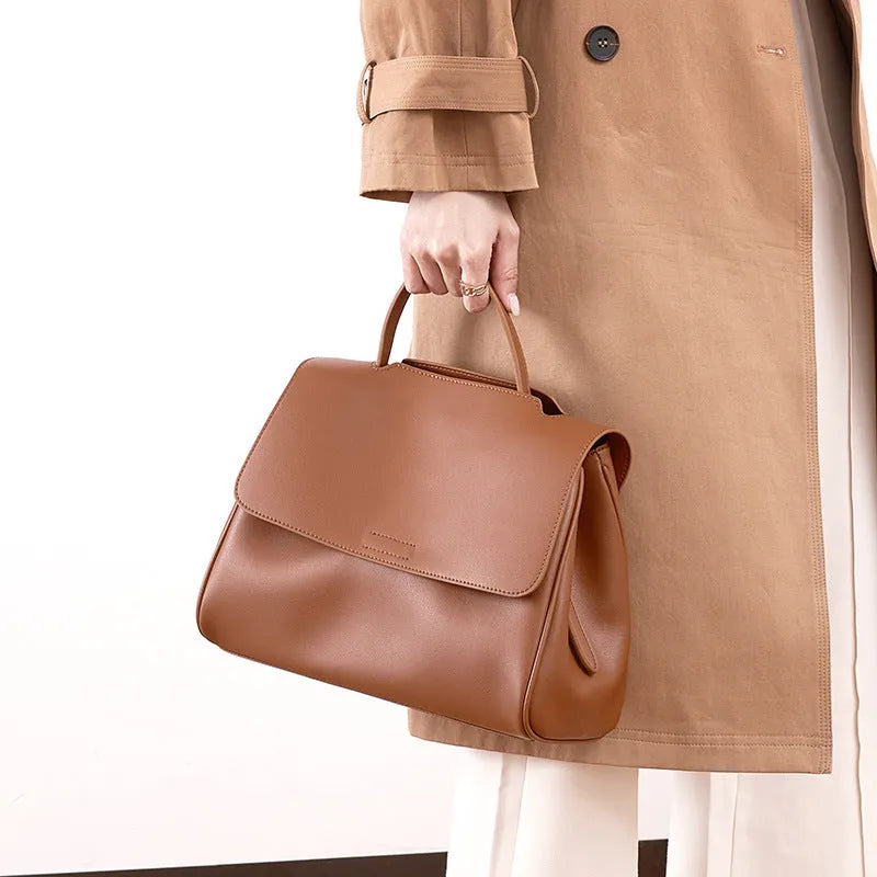 Soft genuine leather women's shoulder messenger bag in horizontal square shape with sewing thread detail, black colour