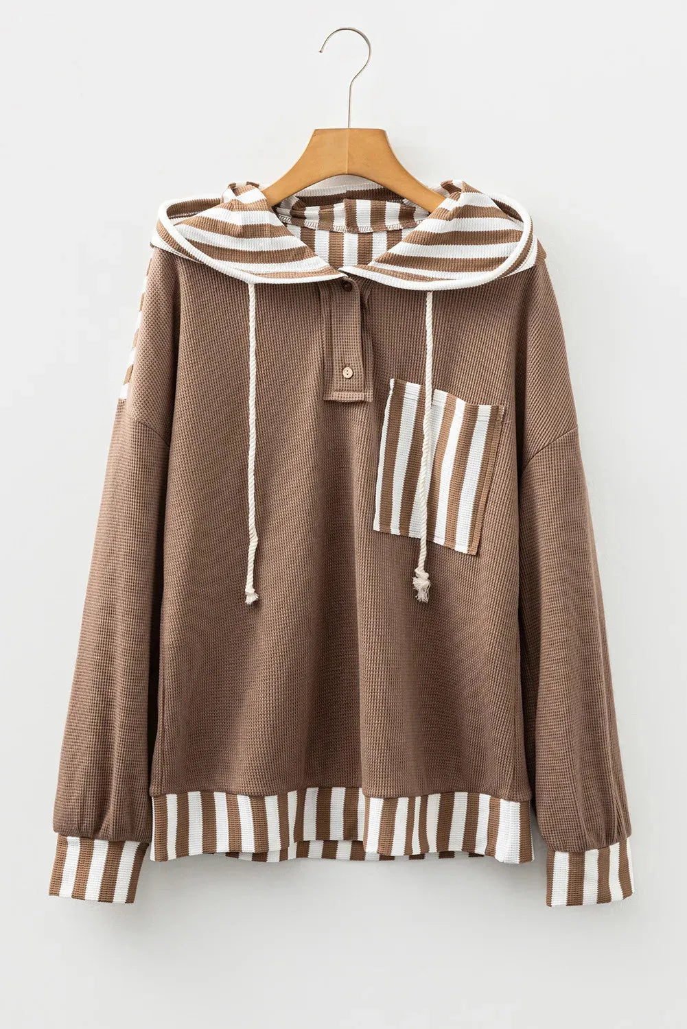 Straw yellow hoodie with waffle texture striped patchwork design featuring drawstring hood and button neck closure