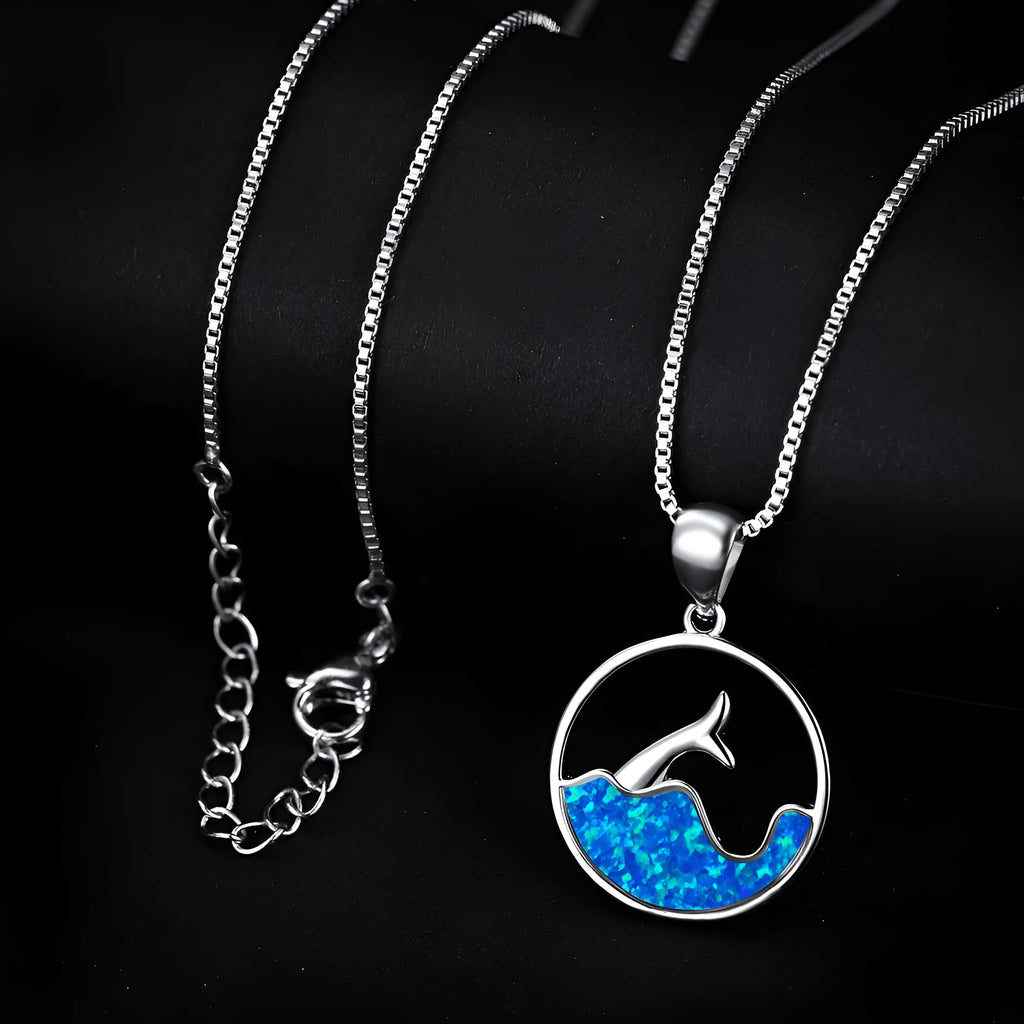 Geometric fishtail pendant necklace with electroplated white gold finish and round decorative elements