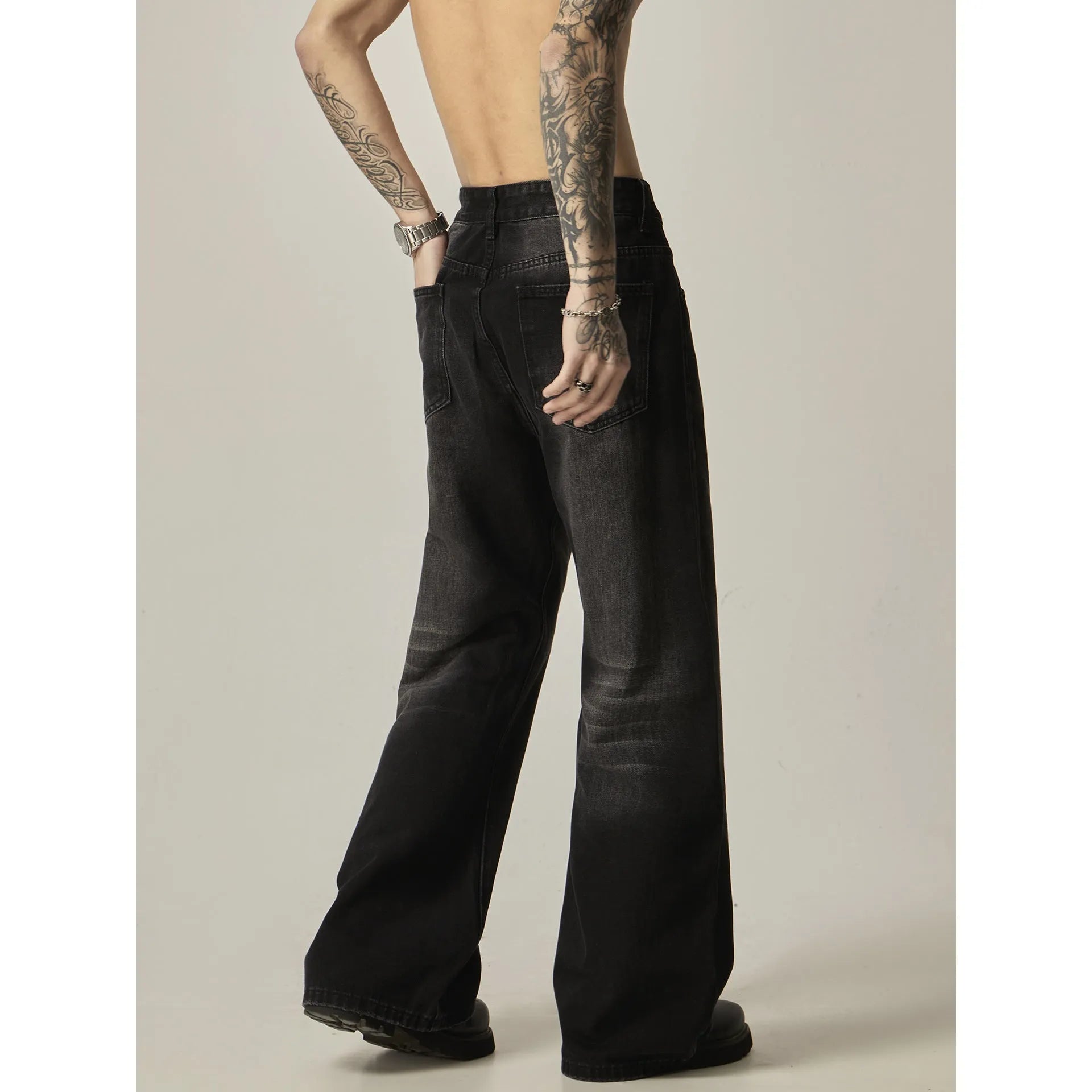 Black loose straight-leg retro jeans with zipper fly on mannequin