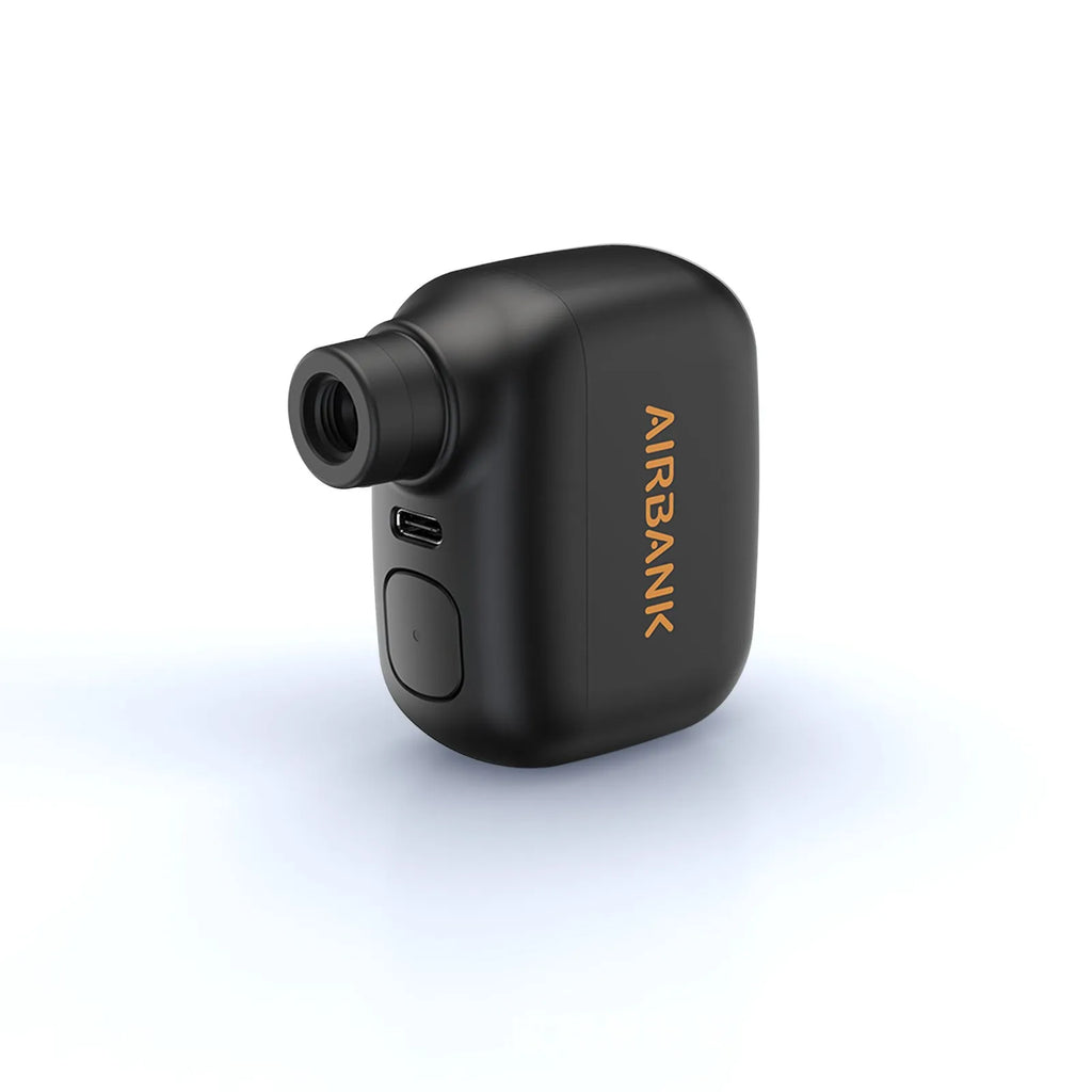 Black AS100 mini electric bicycle tyre pump with USB cable and waterproof storage bag.