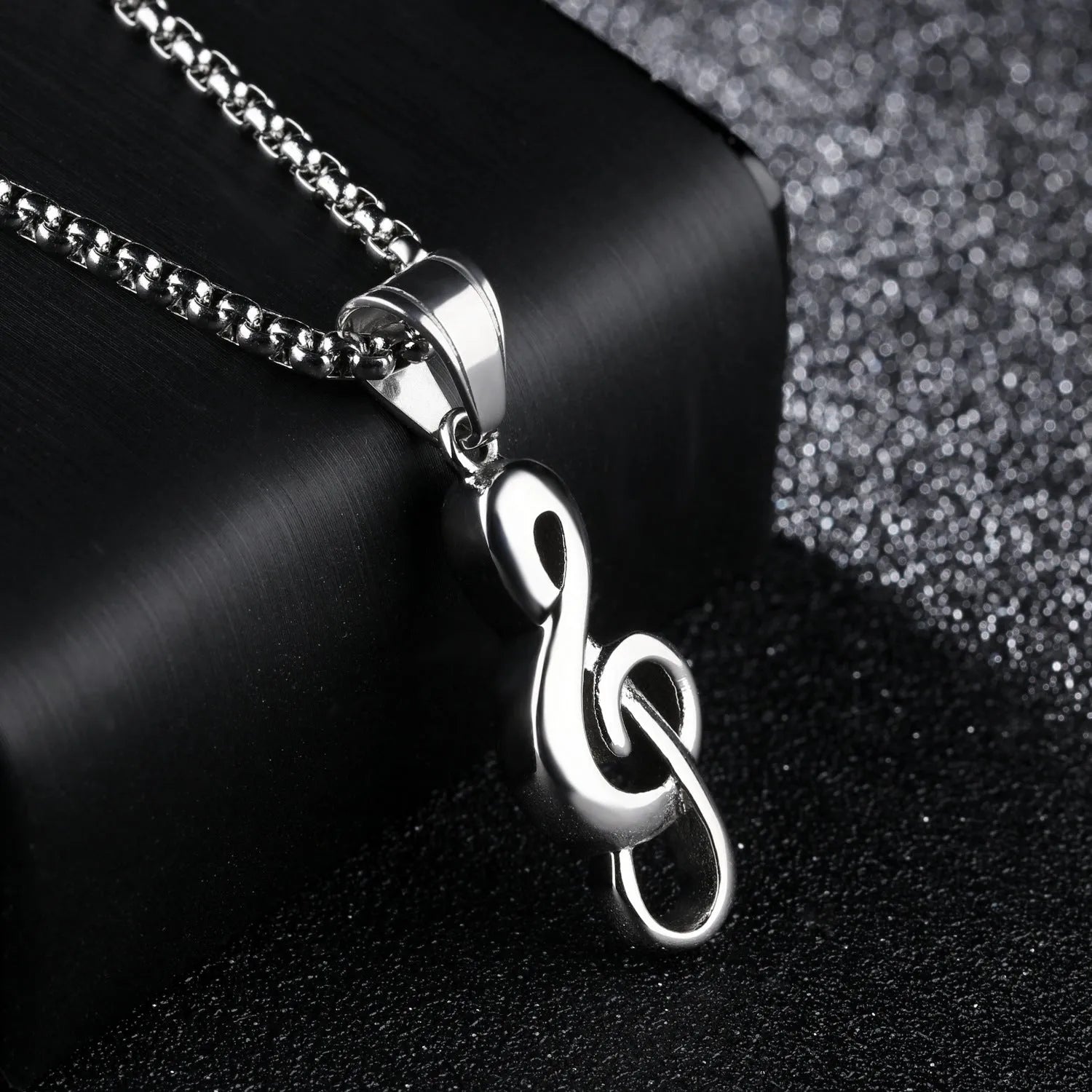Gold music symbol pendant made from titanium steel on a chain