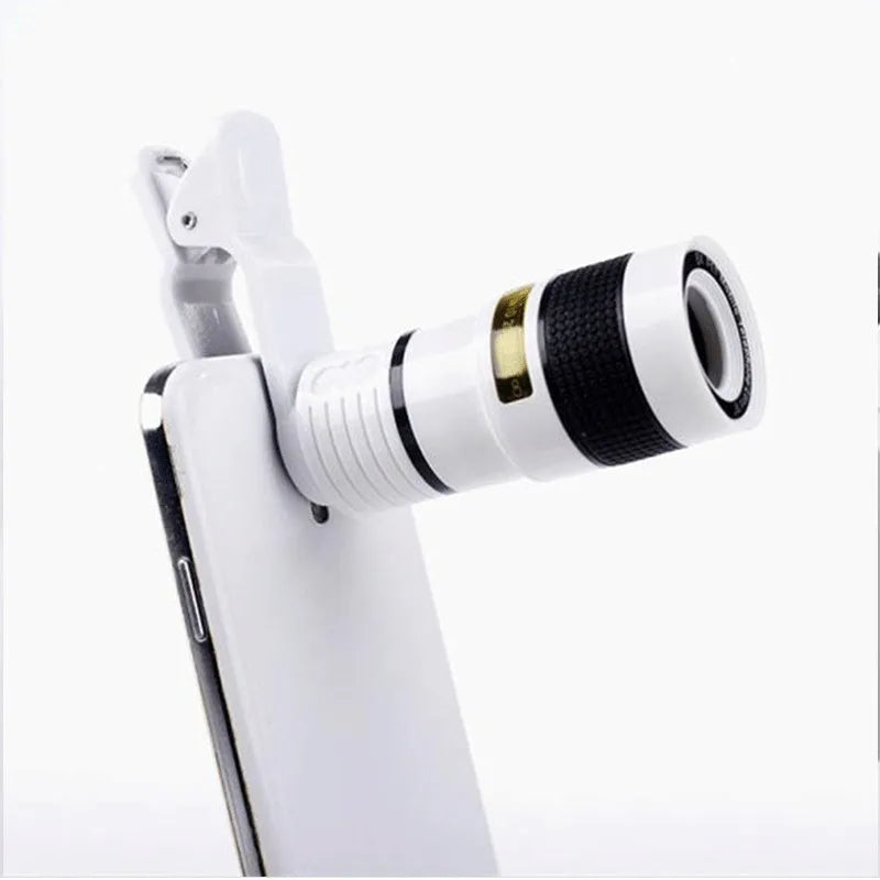 Black 12x mobile phone telescope lens with clip extended next to smartphone