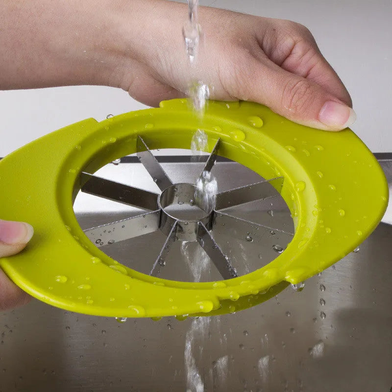 Green kitchen fruit slicer set with apple, tomato, and mango cutters on a stable base